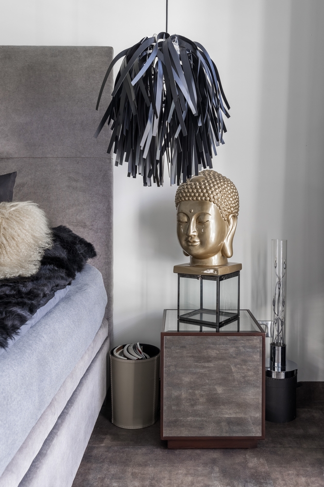 Elegant Buddha Placement in Home beside bed as per vastu for peaceful interiors