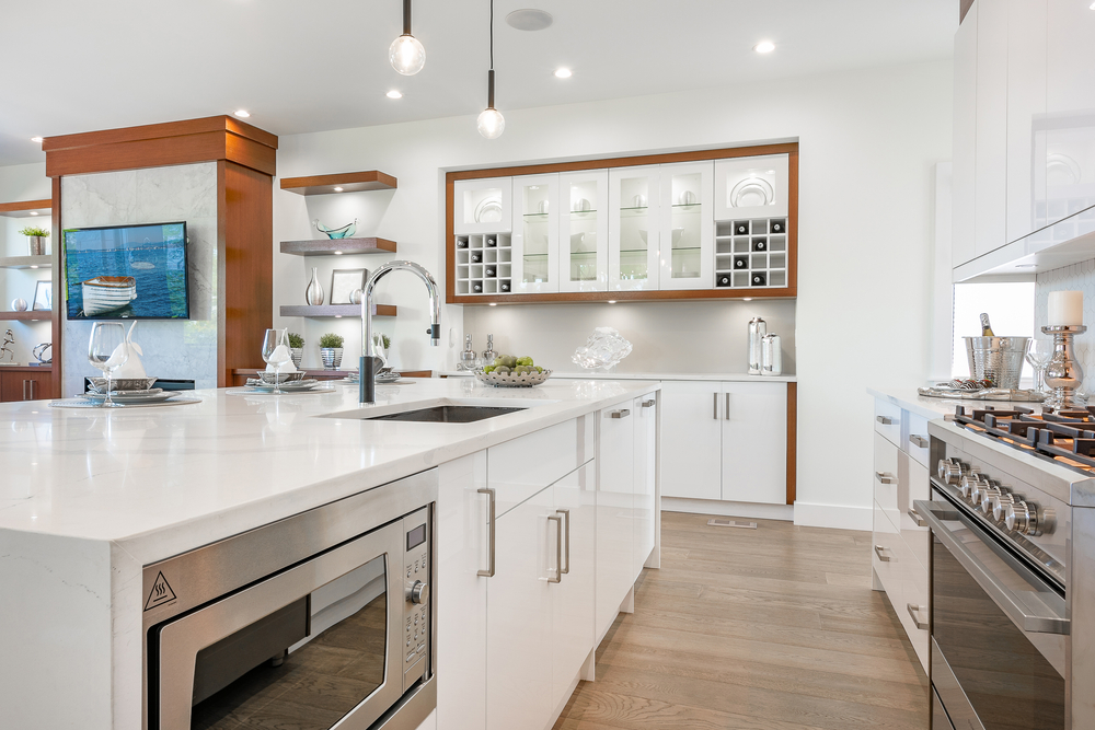 Modern PVC and Wood Modular Kitchen with glossy white and brown cabinets