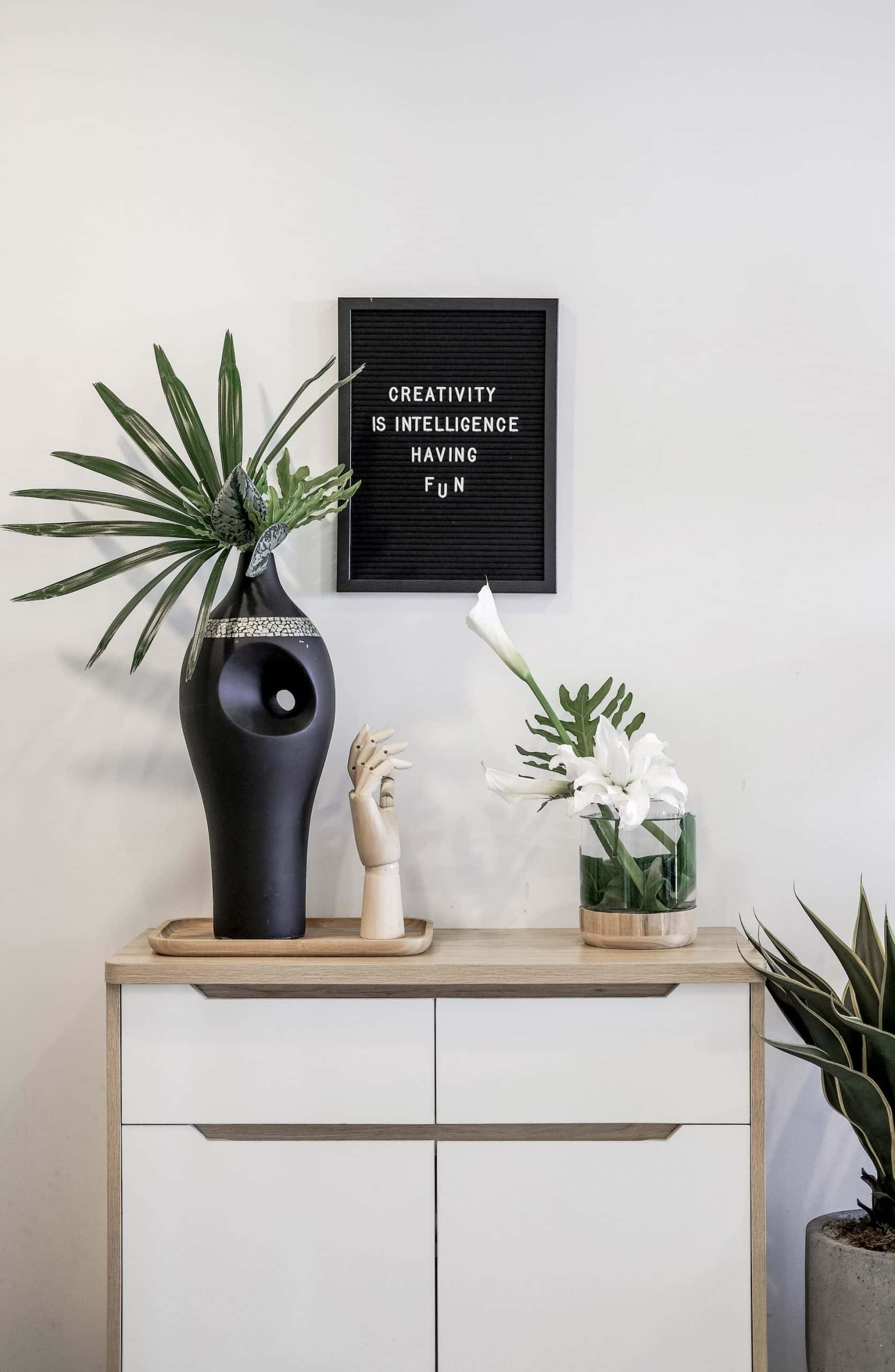 living room setup with artificial flowers
