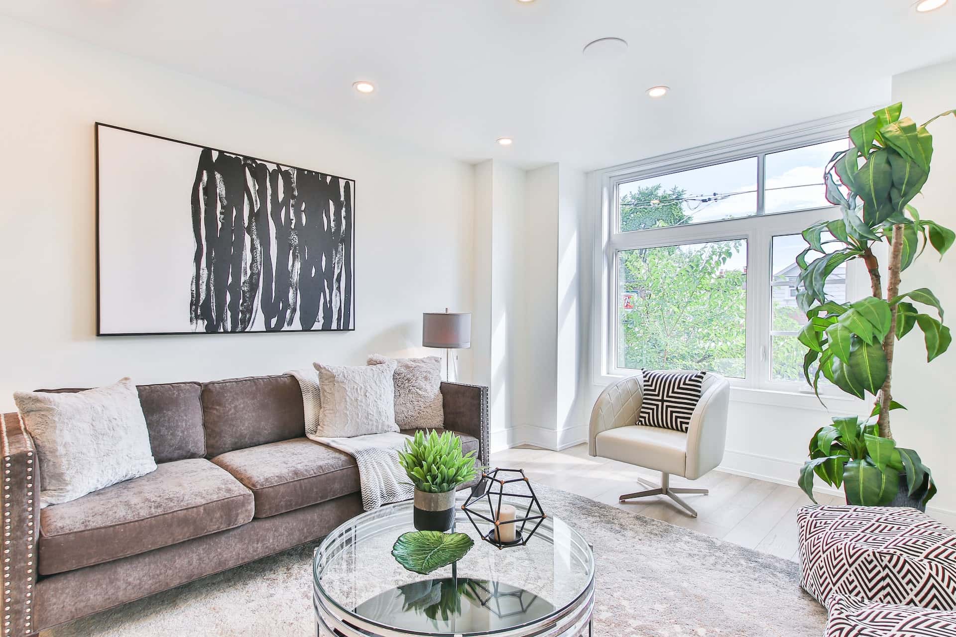 Contemporary lobby interior design with bright natural light and artistic decor