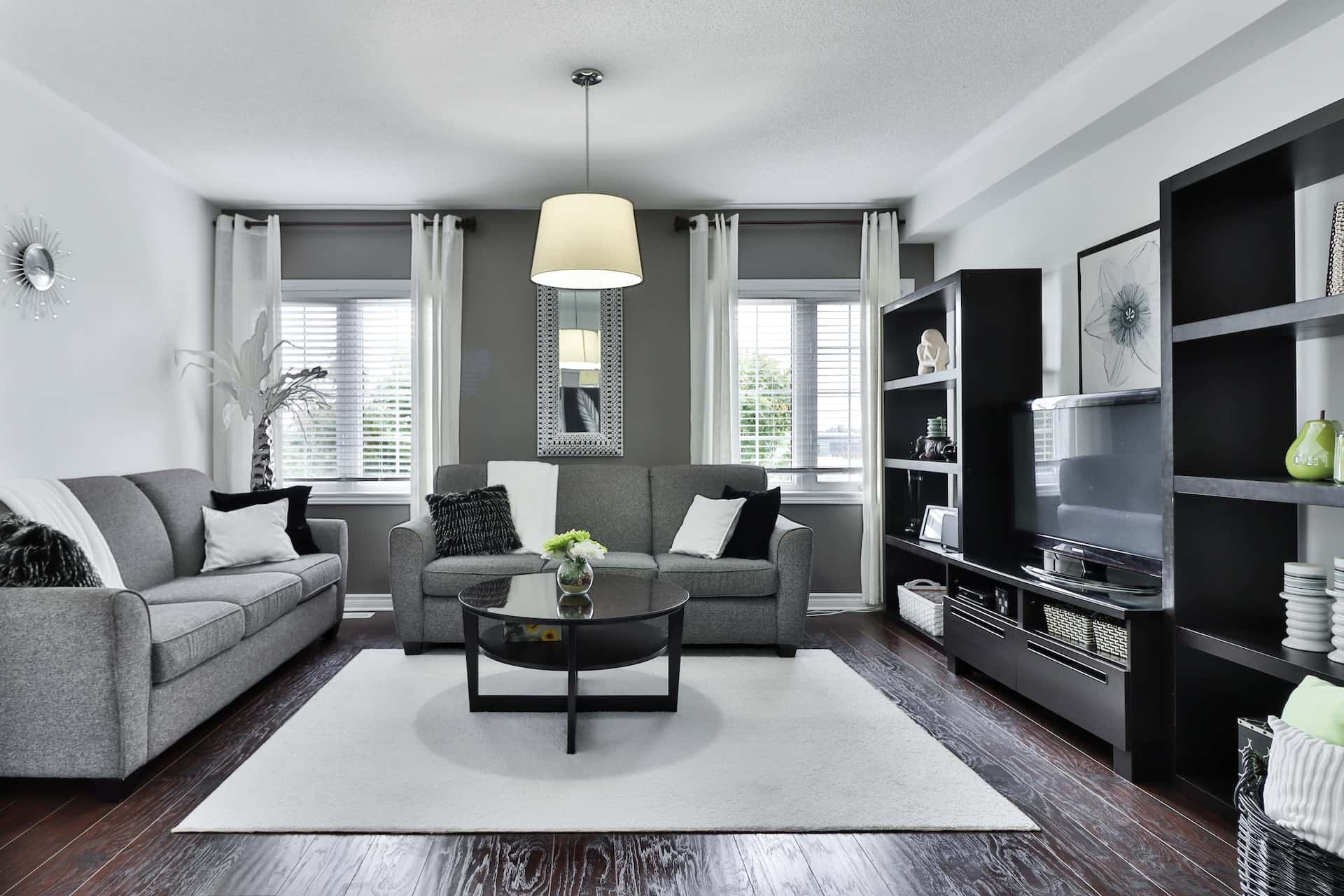 Minimalist lobby interior design with grey tones, clean lines, and soft lighting