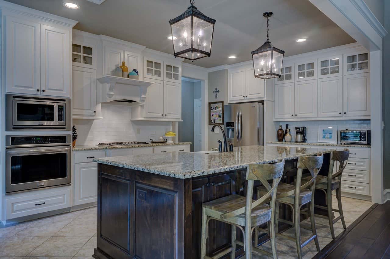 Elegant cafe style kitchens with rustic wood island and cozy lighting ambiance