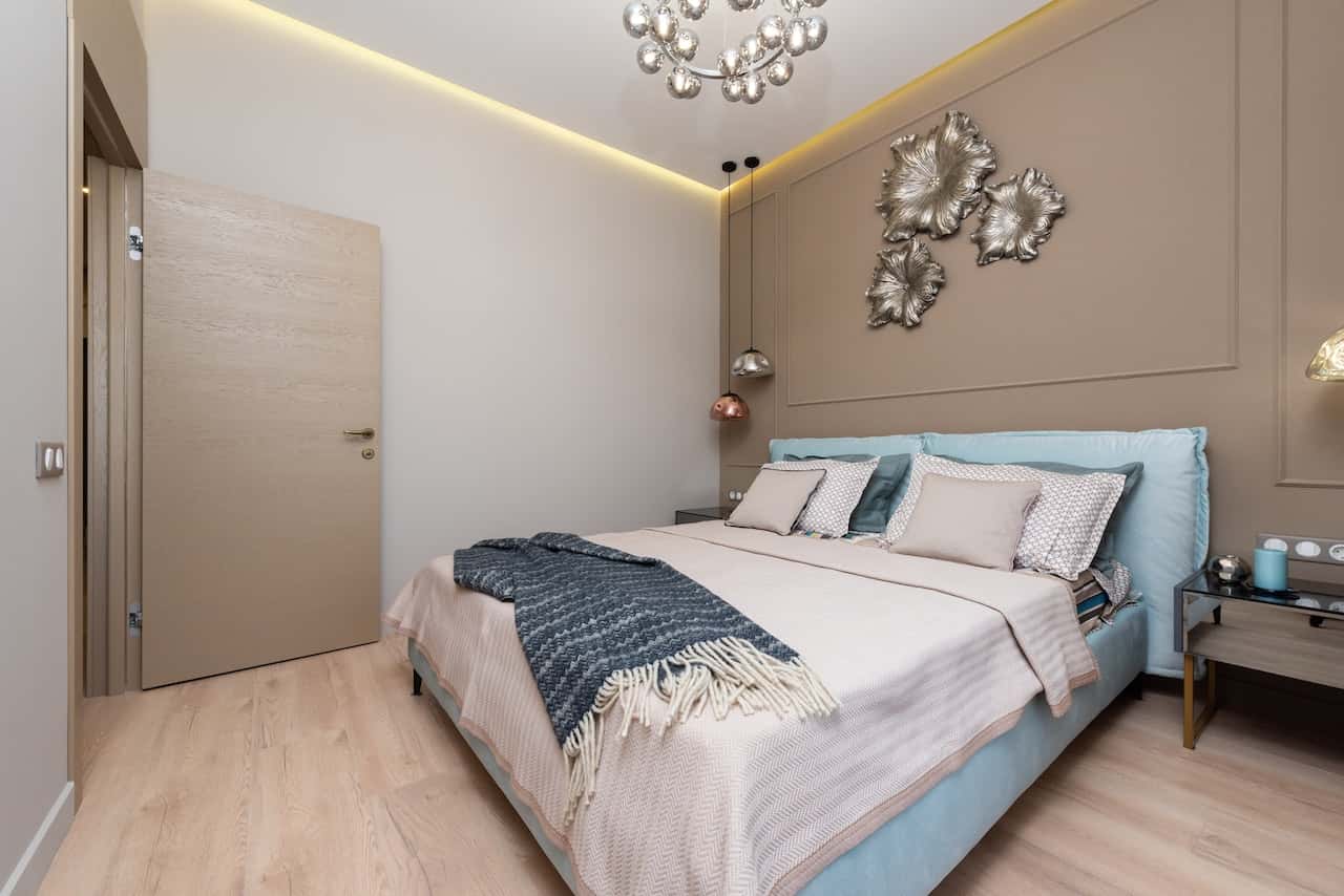 Elegant flush door designs in bedroom with wooden finish and modern veneer style