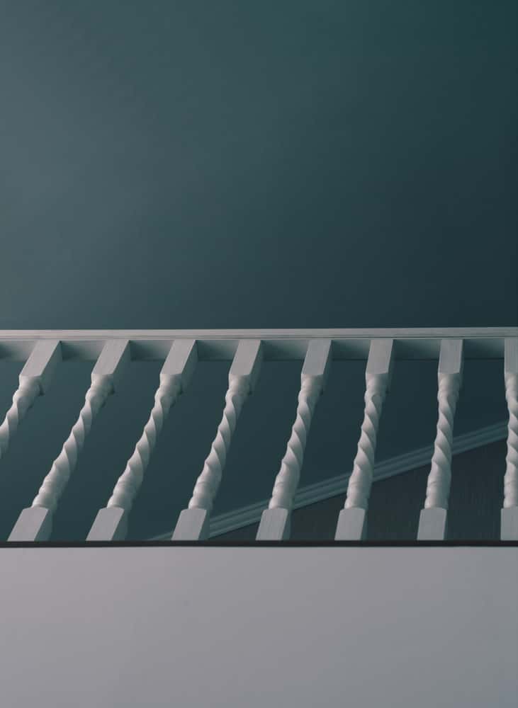 Twisted staircase railing design with classic staircase lighting ideas