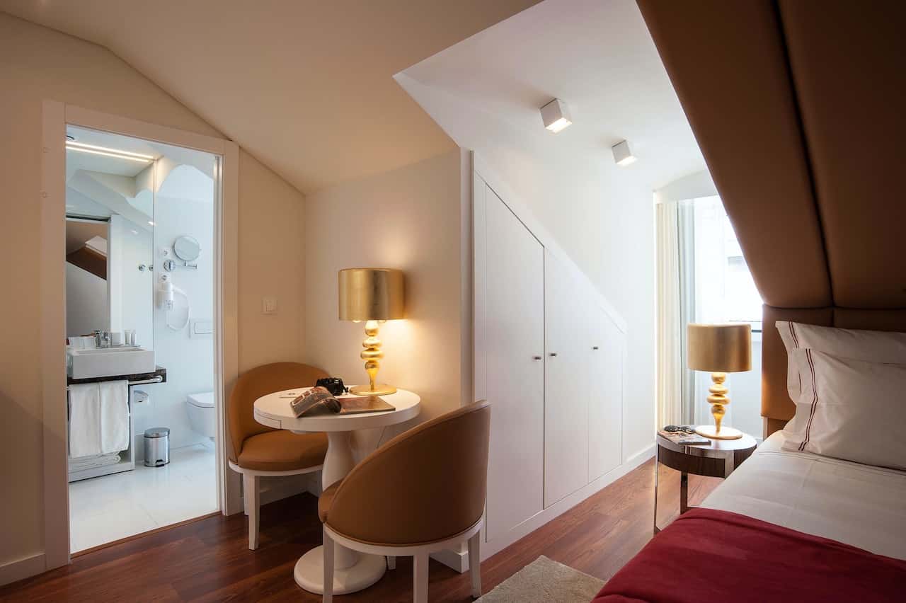 ensuite bathroom with a compact bedroom