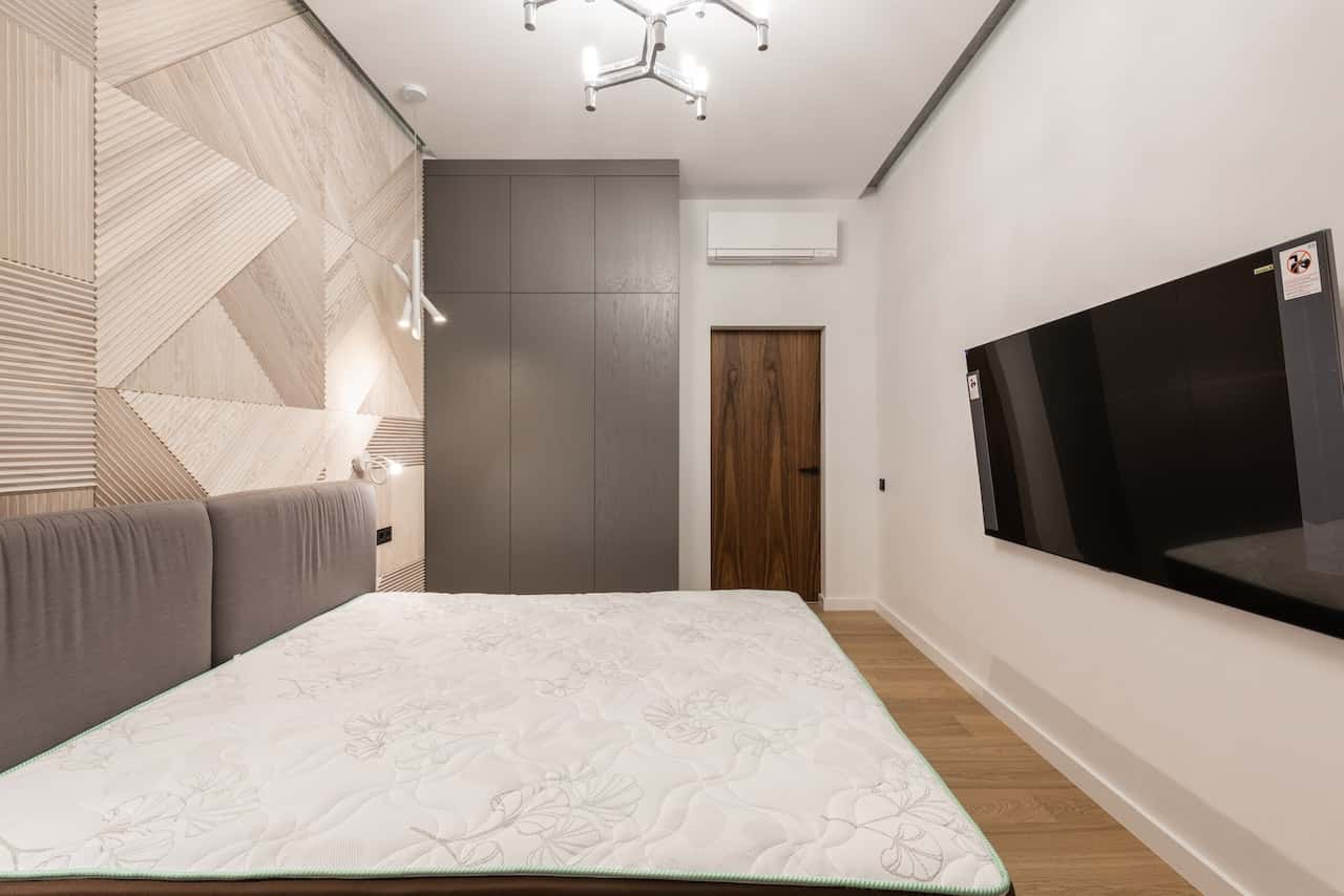Stylish flush door designs in wood for a modern bedroom interior look
