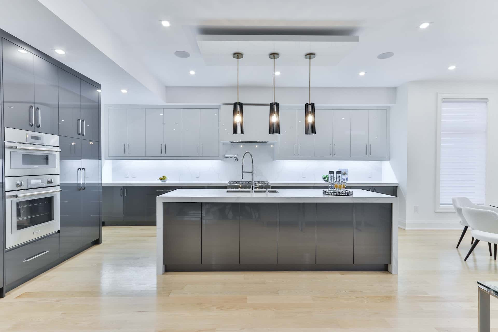 Sleek standard kitchen size layout with grey cabinets and island counter