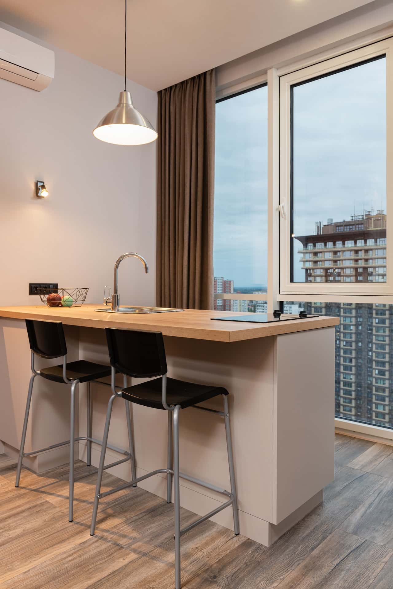 Minimalist standard kitchen size with island counter and city view