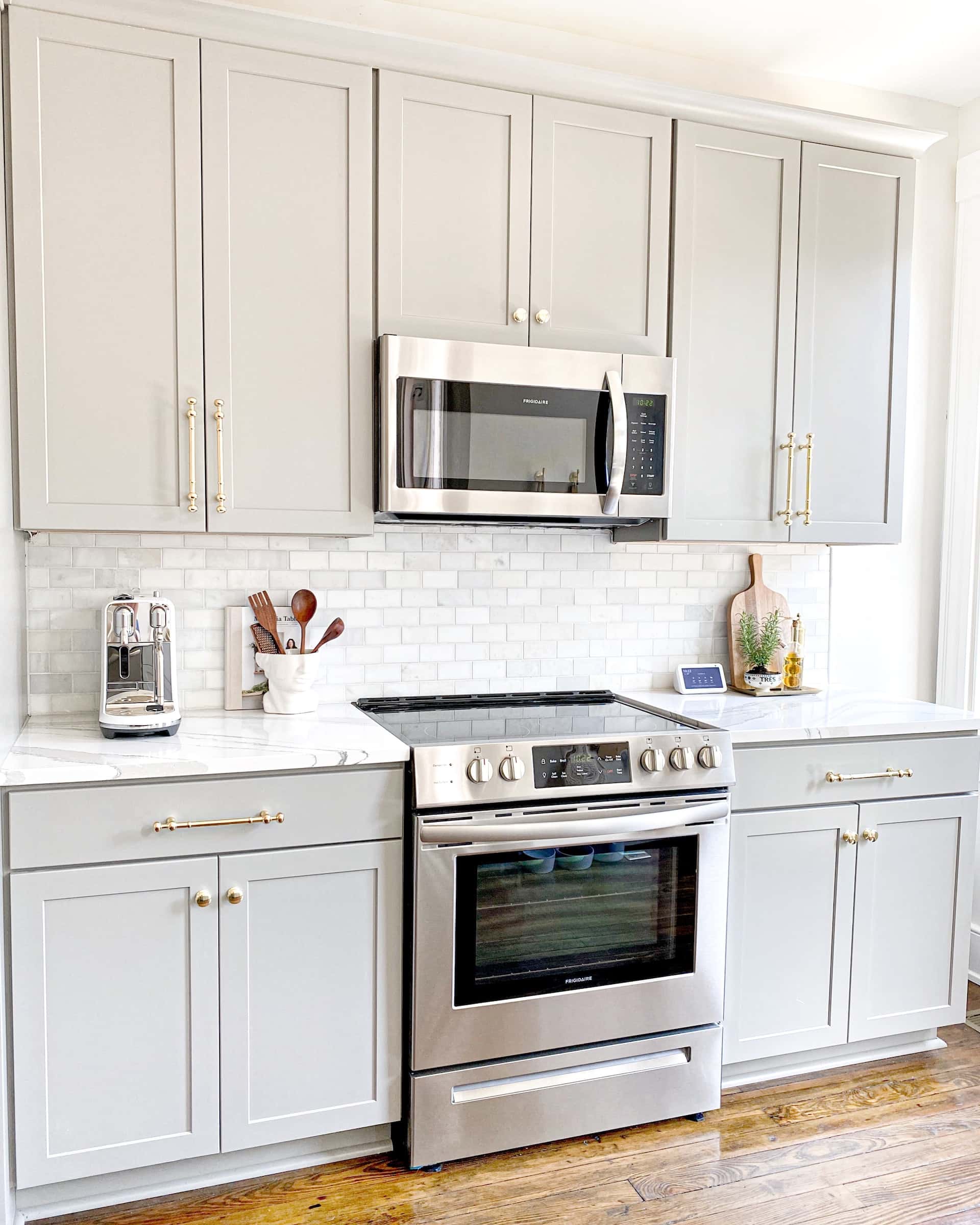 Standard kitchen size with sleek cabinets and built-in microwave oven