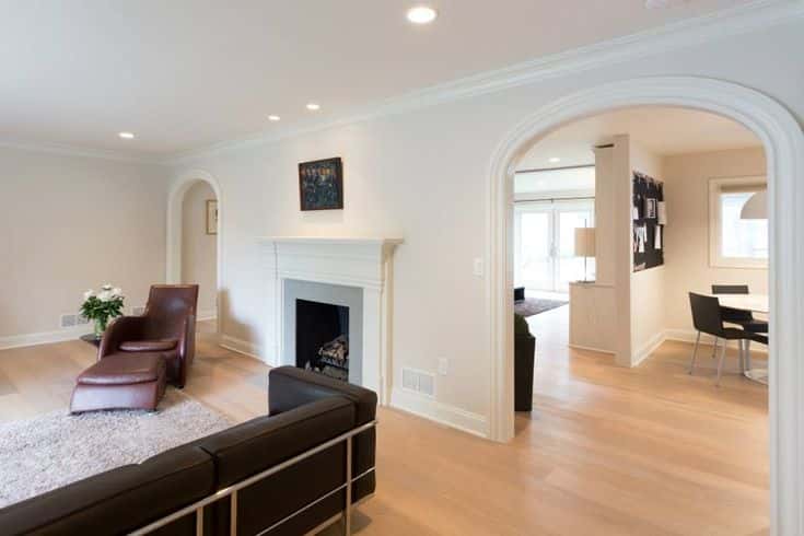 living room with a wide arch design 