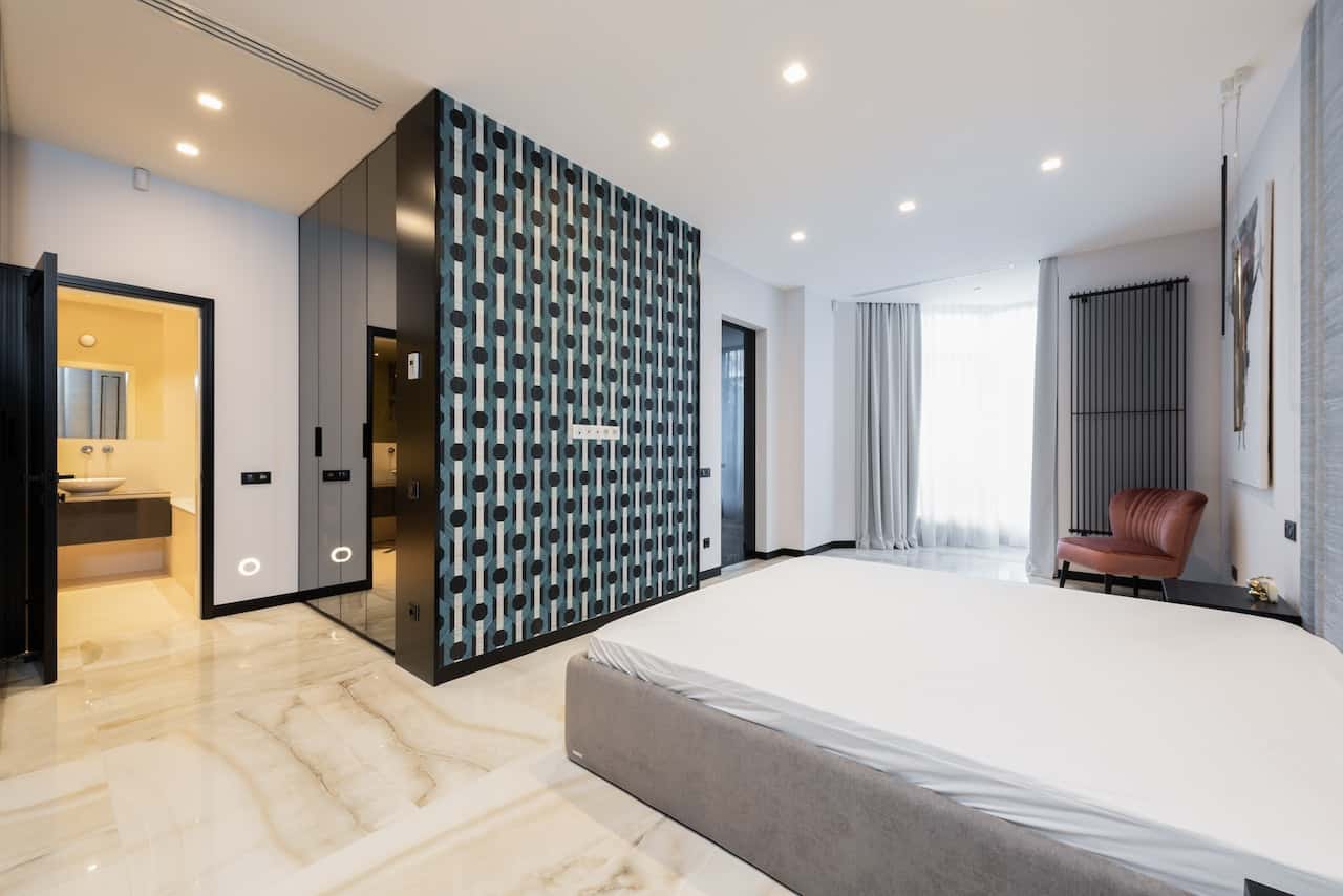 master bedroom with an attached bathroom