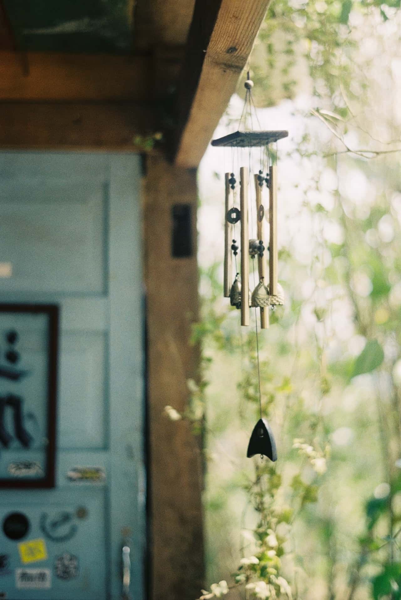 Soothing wind chimes vastu element hanging near wooden roof for good energy flow
