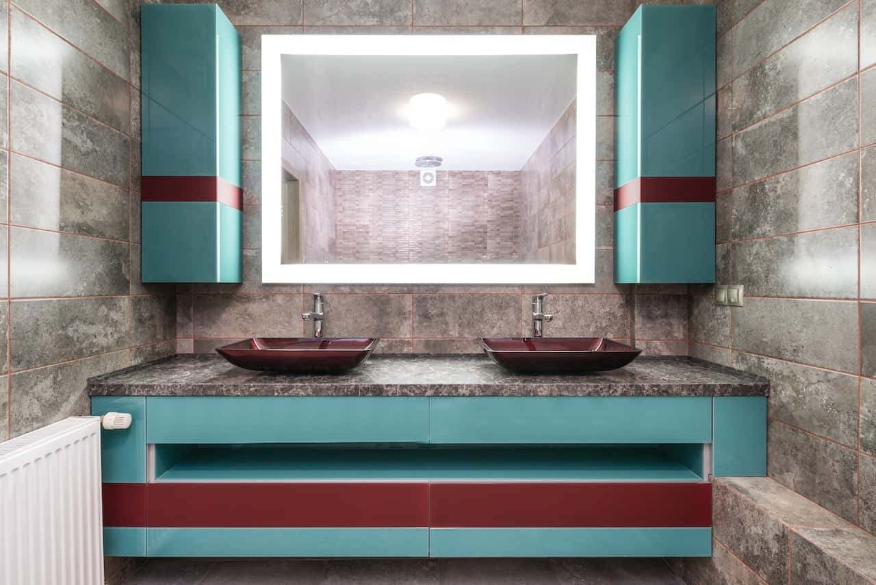 mirror with a modern sink style light