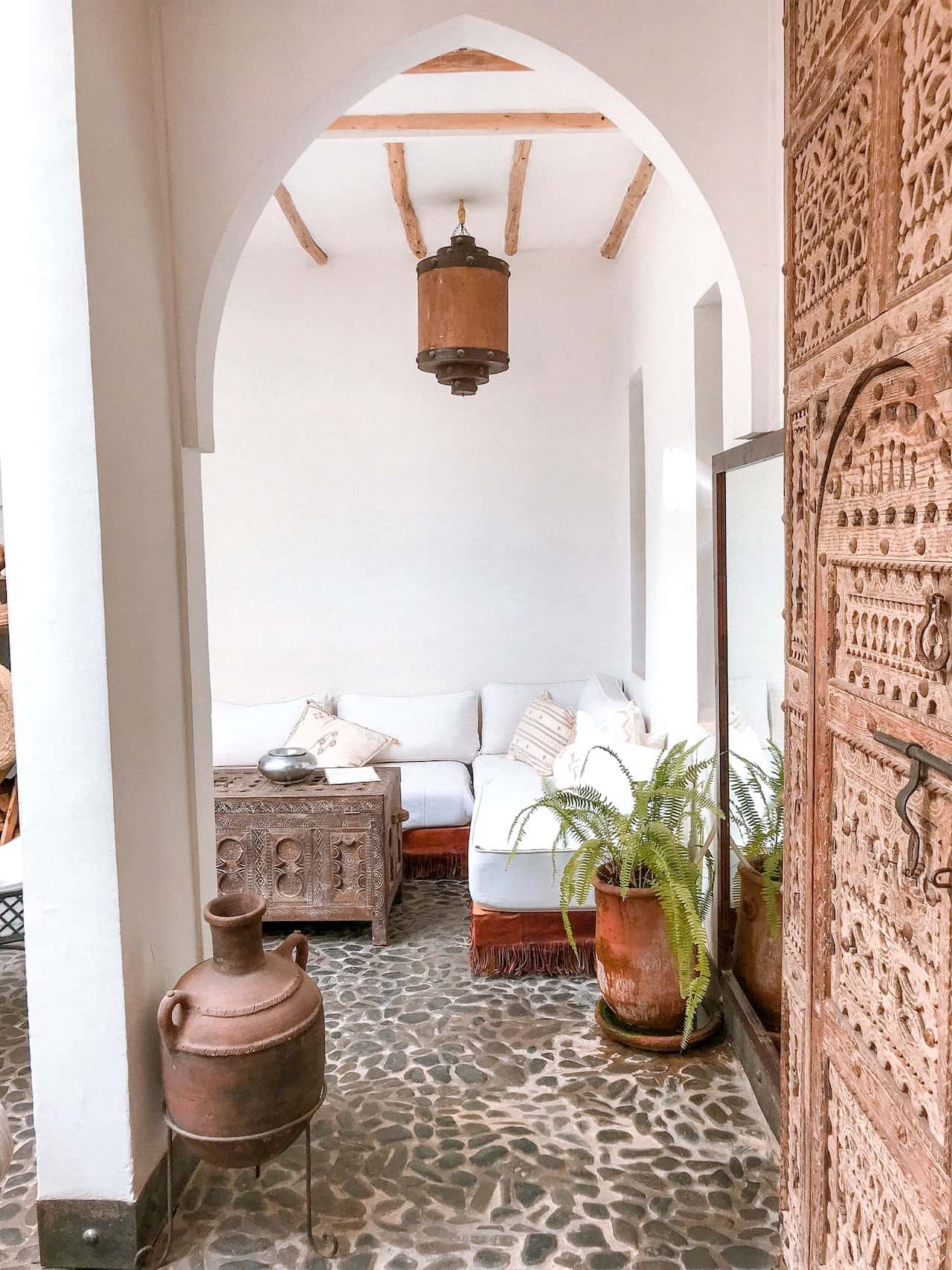 Rustic charm pop design for porch with wooden beams and arch ceiling frame