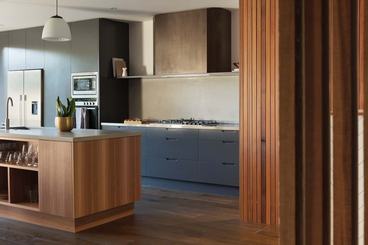 Stylish kitchen entrance design featuring wooden elements and modern appliances