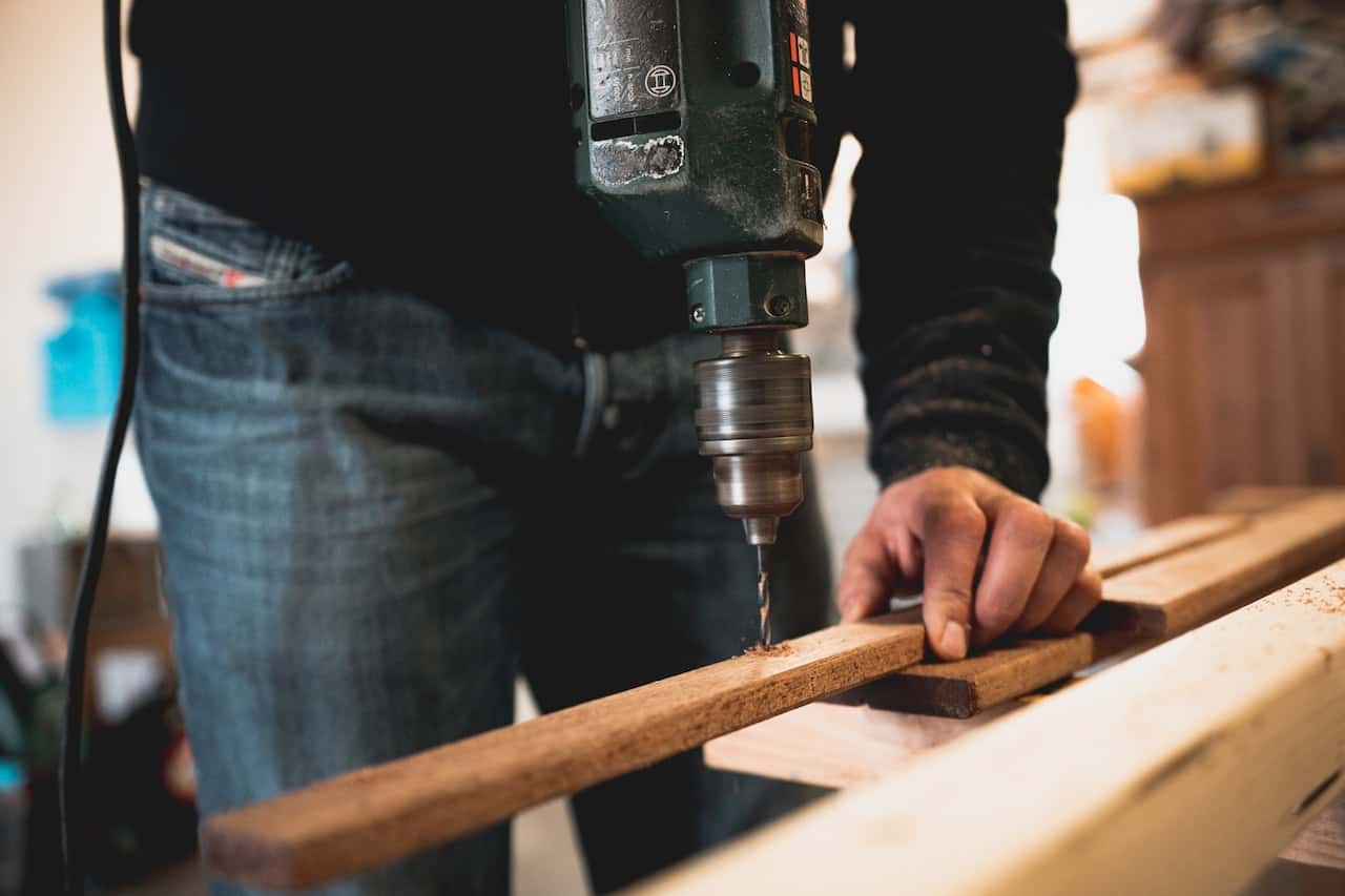 Precision woodwork during modular setup for a custom standard kitchen size installation