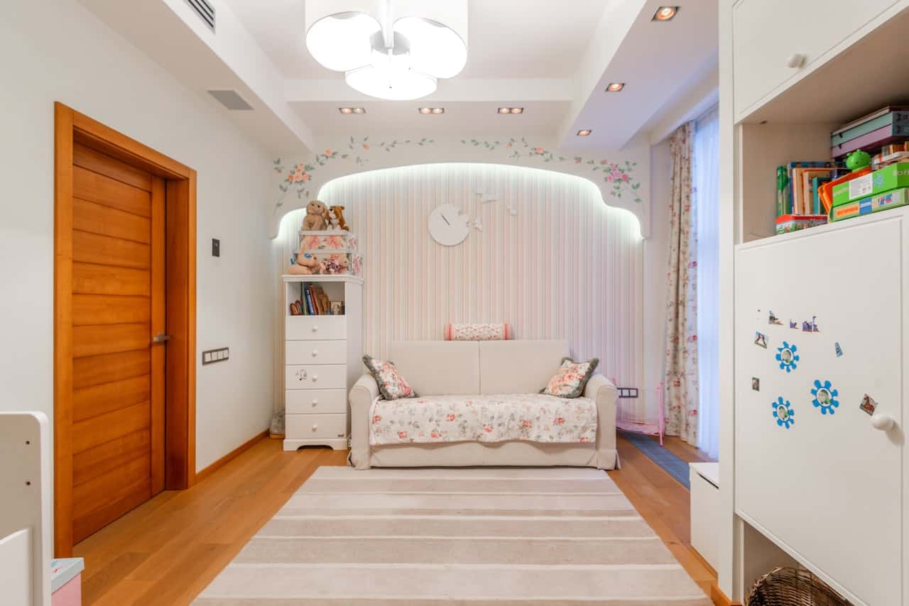 Elegant flush door designs in wood for a cozy kids’ bedroom interior