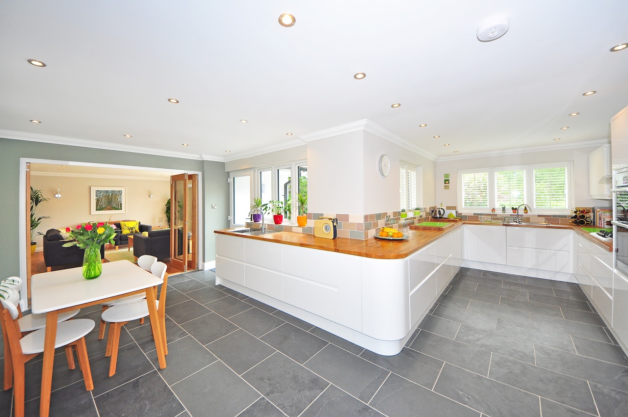 Bright open kitchen entrance design with modern white interiors