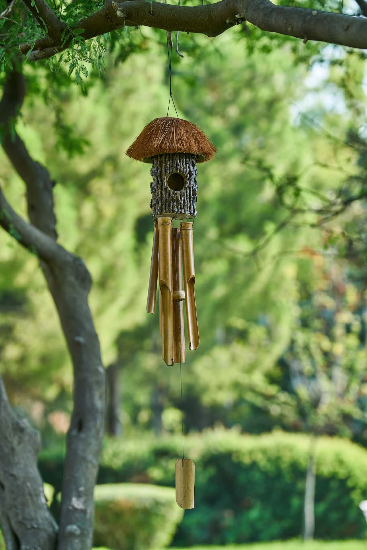 Natural bamboo wind chimes vastu piece hanging outdoors for peace and prosperity
