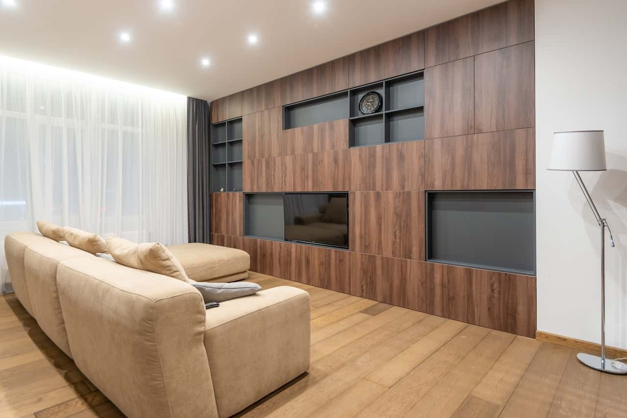 Modern cement cupboard designs with wooden finish and built-in TV unit
