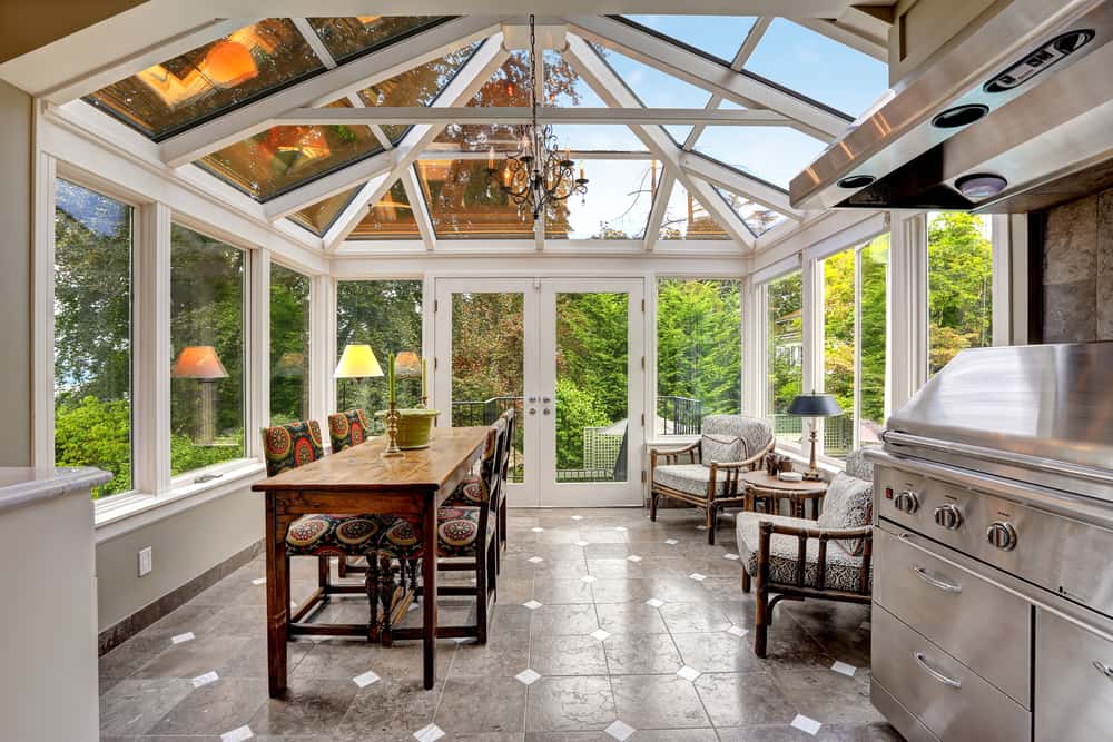 Bright glass ceiling design for a modern dining space with scenic outdoor views