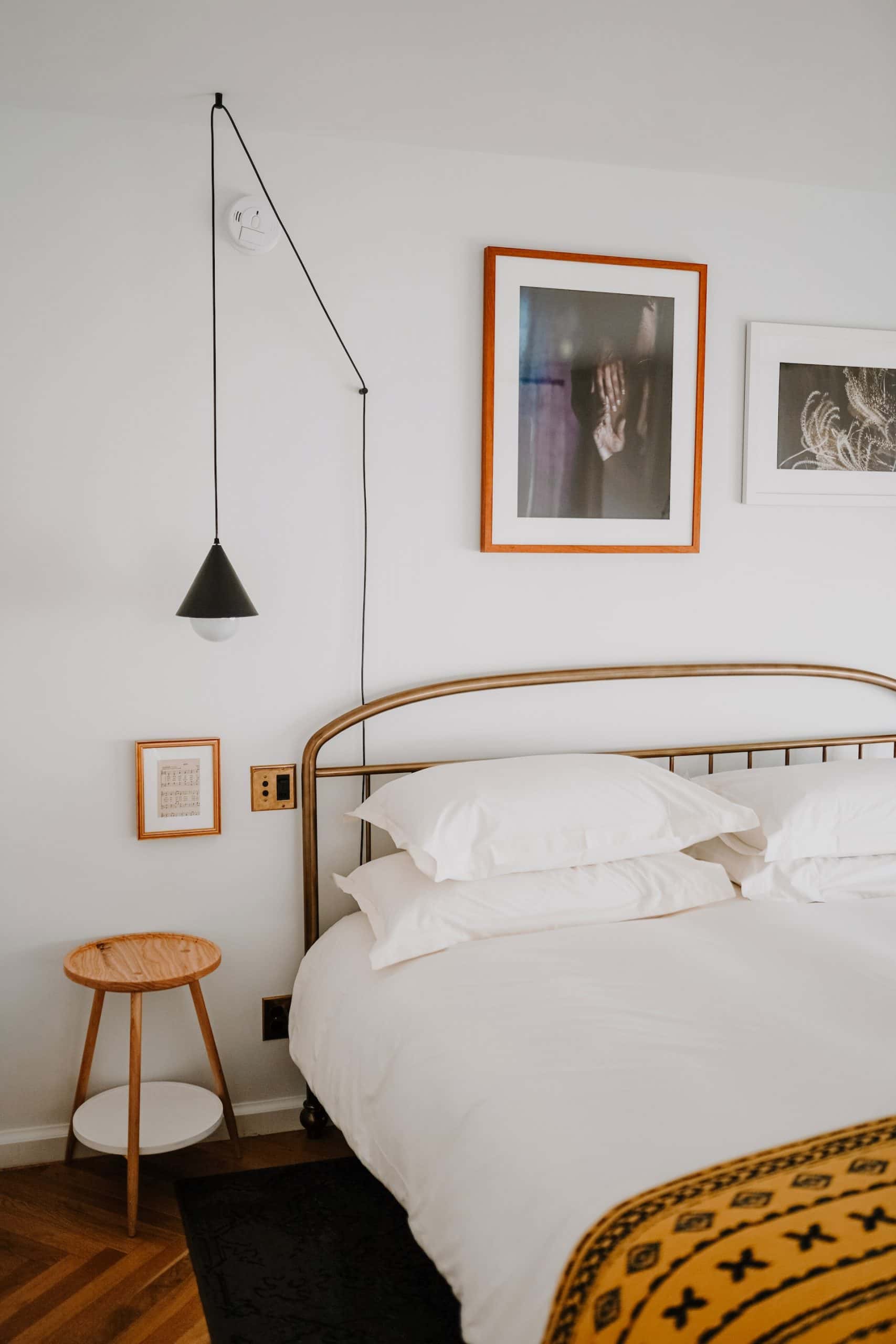 bedroom wall design with hanging lamp