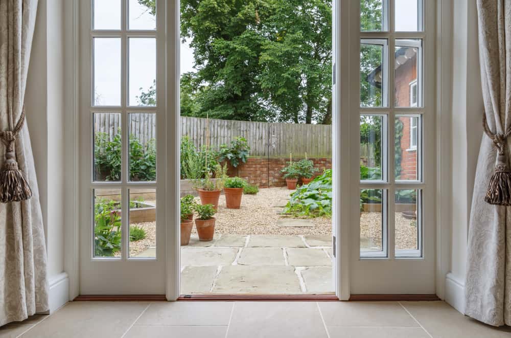 Elegant mosquito net door designs for home with garden view