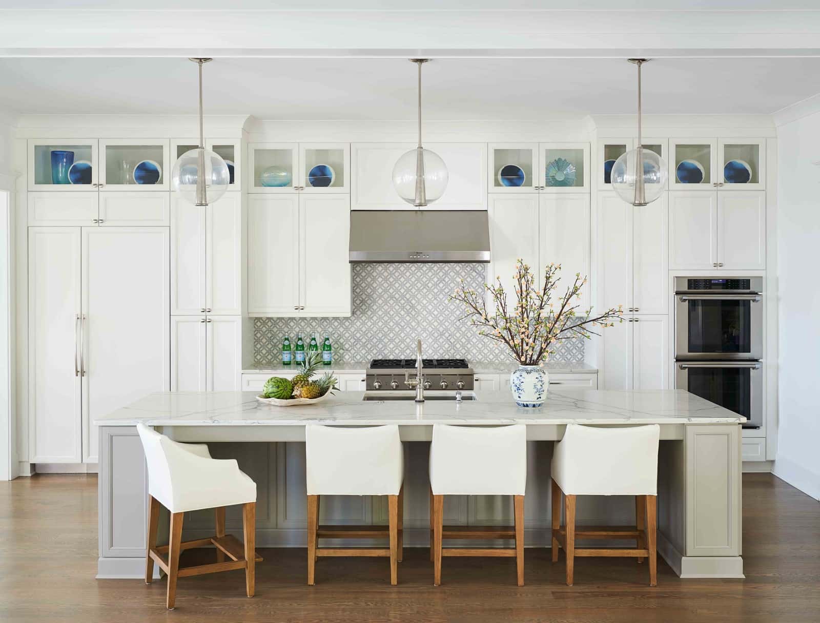 Latest Kitchen Platform Designs white kitchen, large island, counter stools.