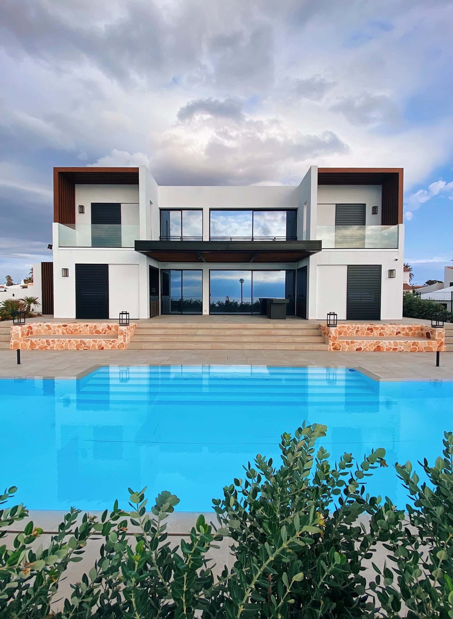 box type house design with multiple balconies