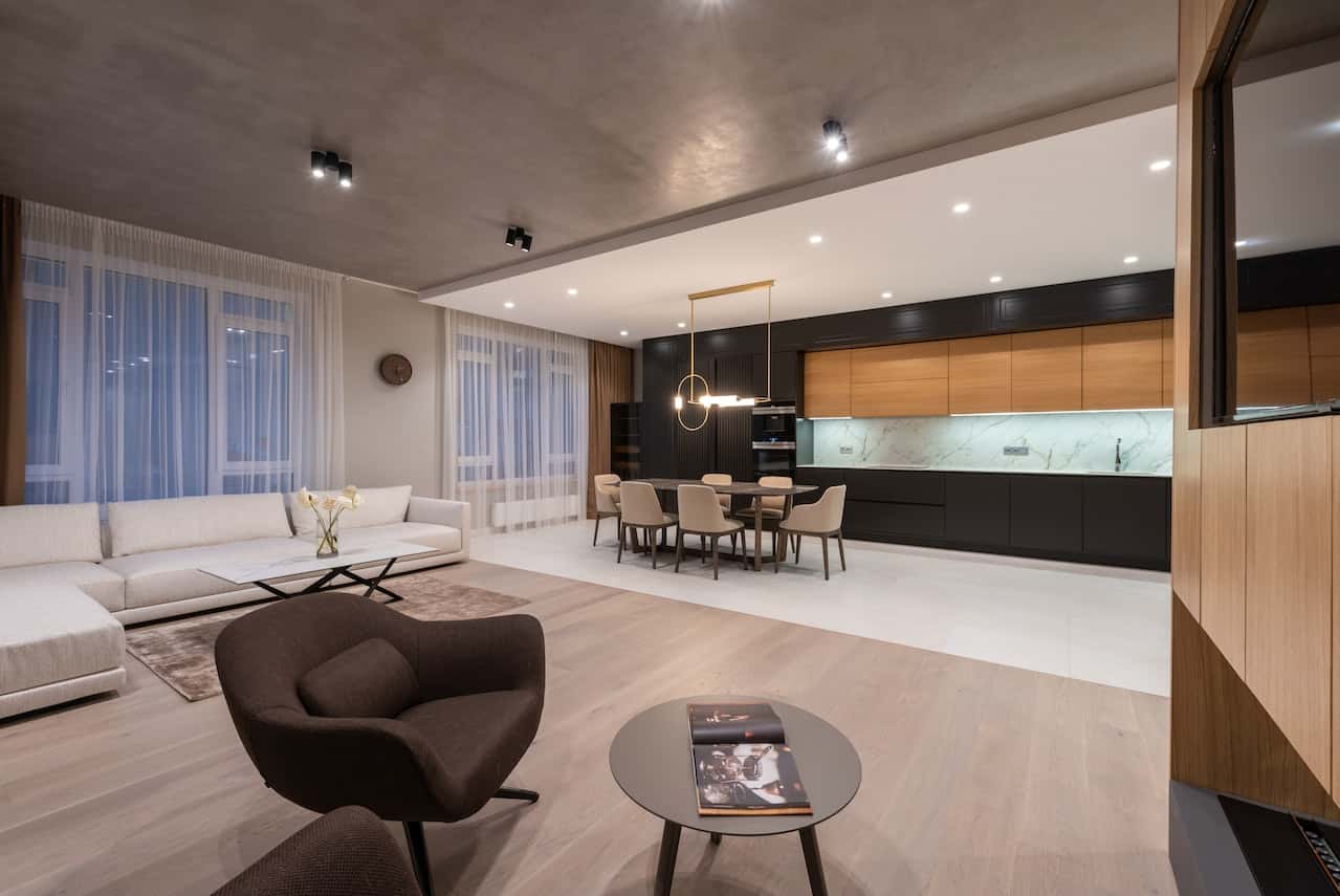 Elegant fiber ceiling designs enhance this modern living and dining room interior
