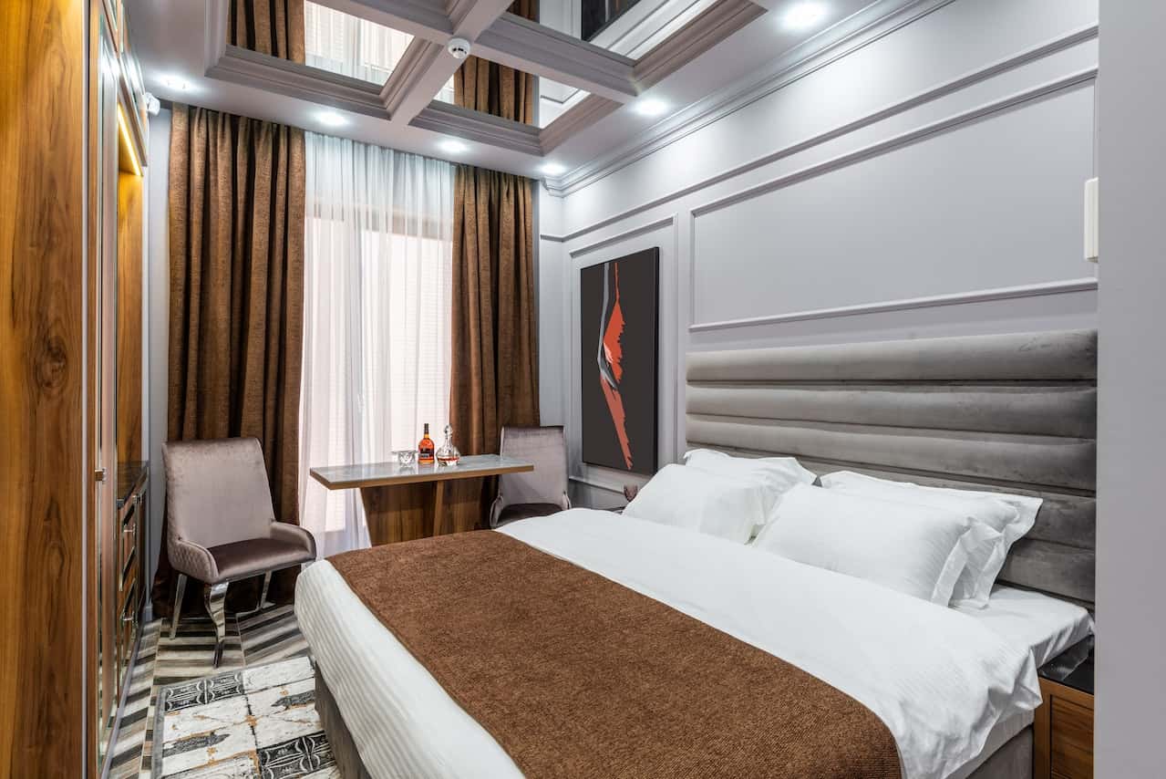 Cozy modern bedroom with fiber ceiling designs and soft layered lighting