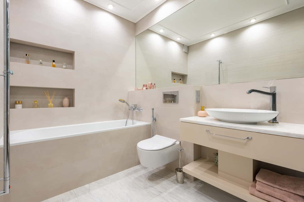 Modern cement cupboard designs with built-in shelves for bathroom storage