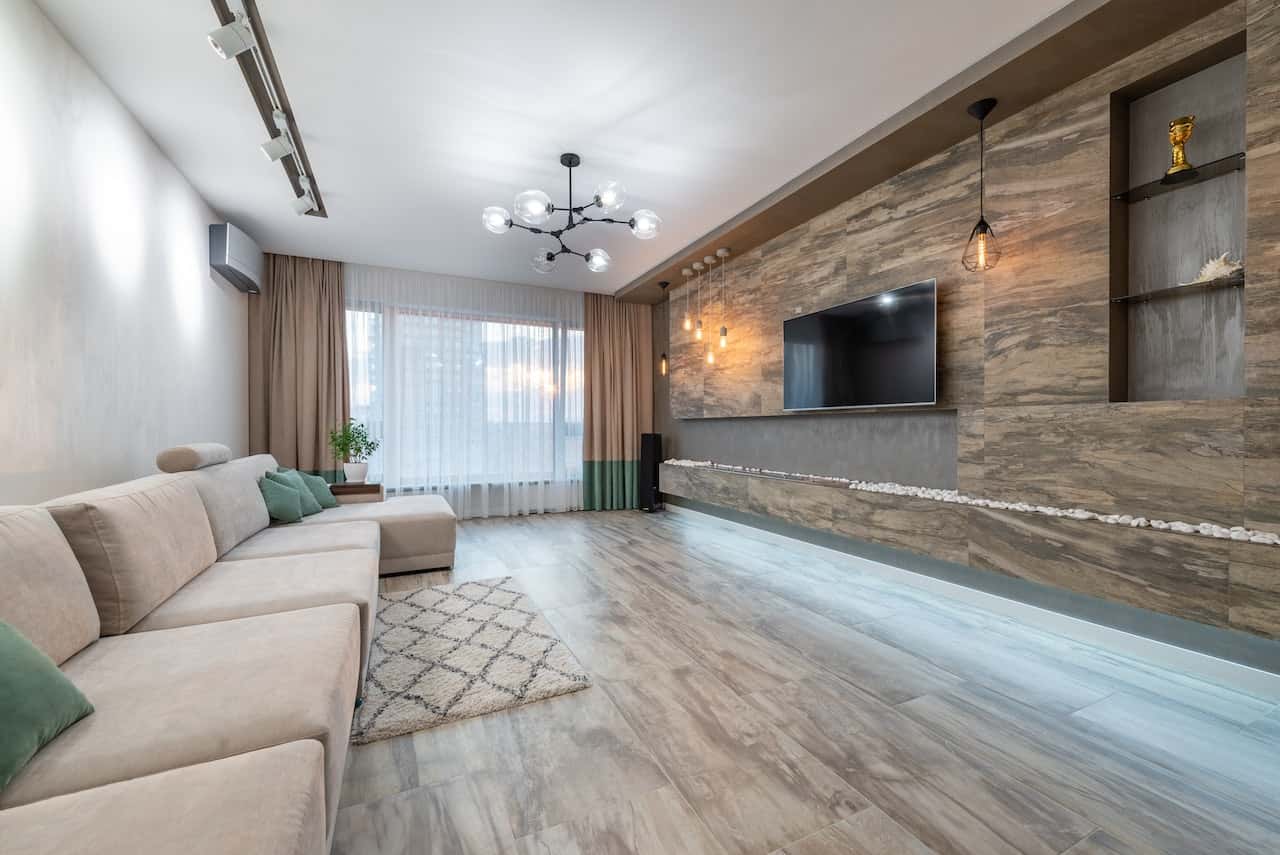 Stylish cement cupboard designs with wall-mounted TV unit in modern hall