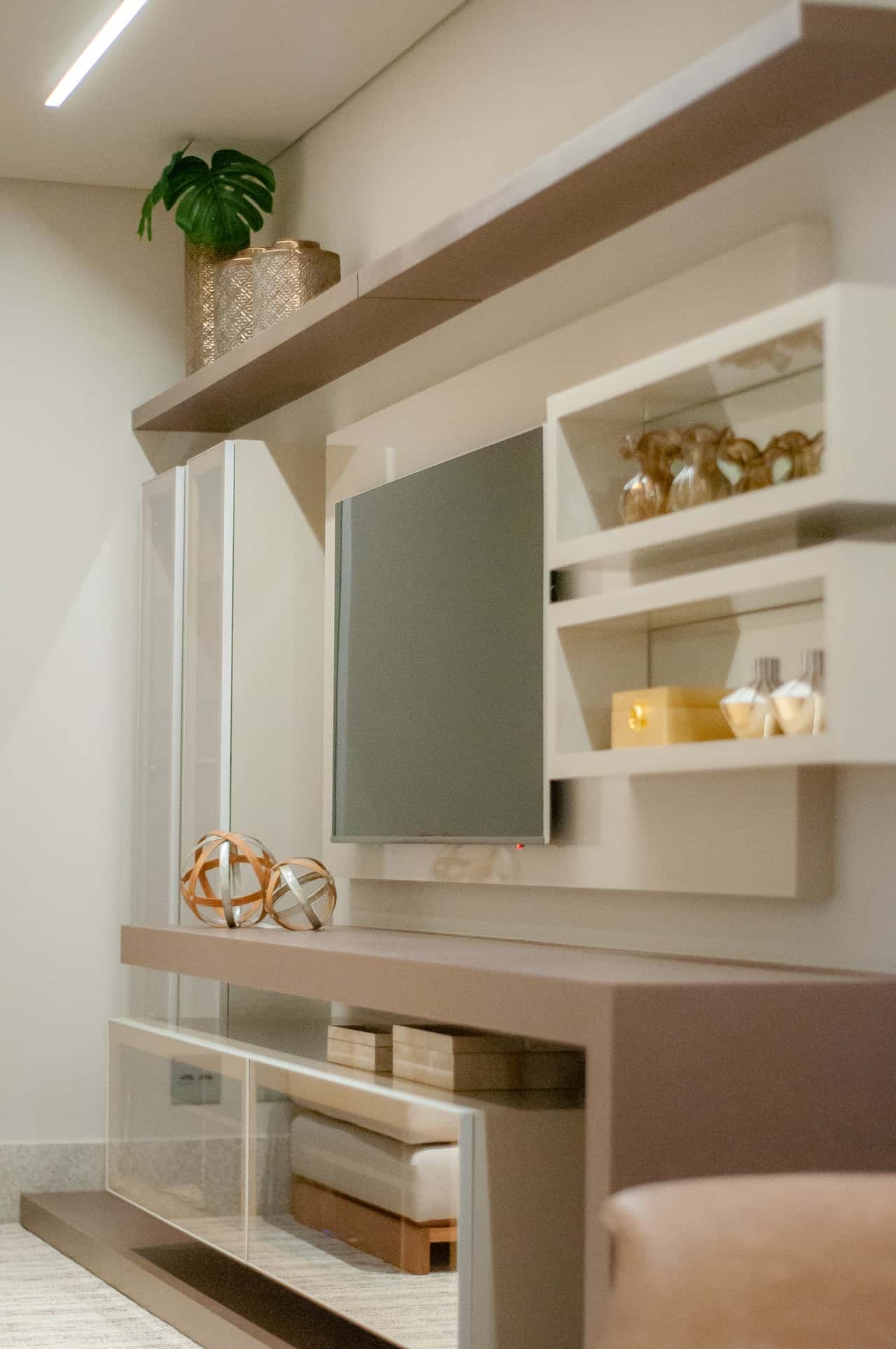 Contemporary cement cupboard designs with sleek shelves and TV wall unit