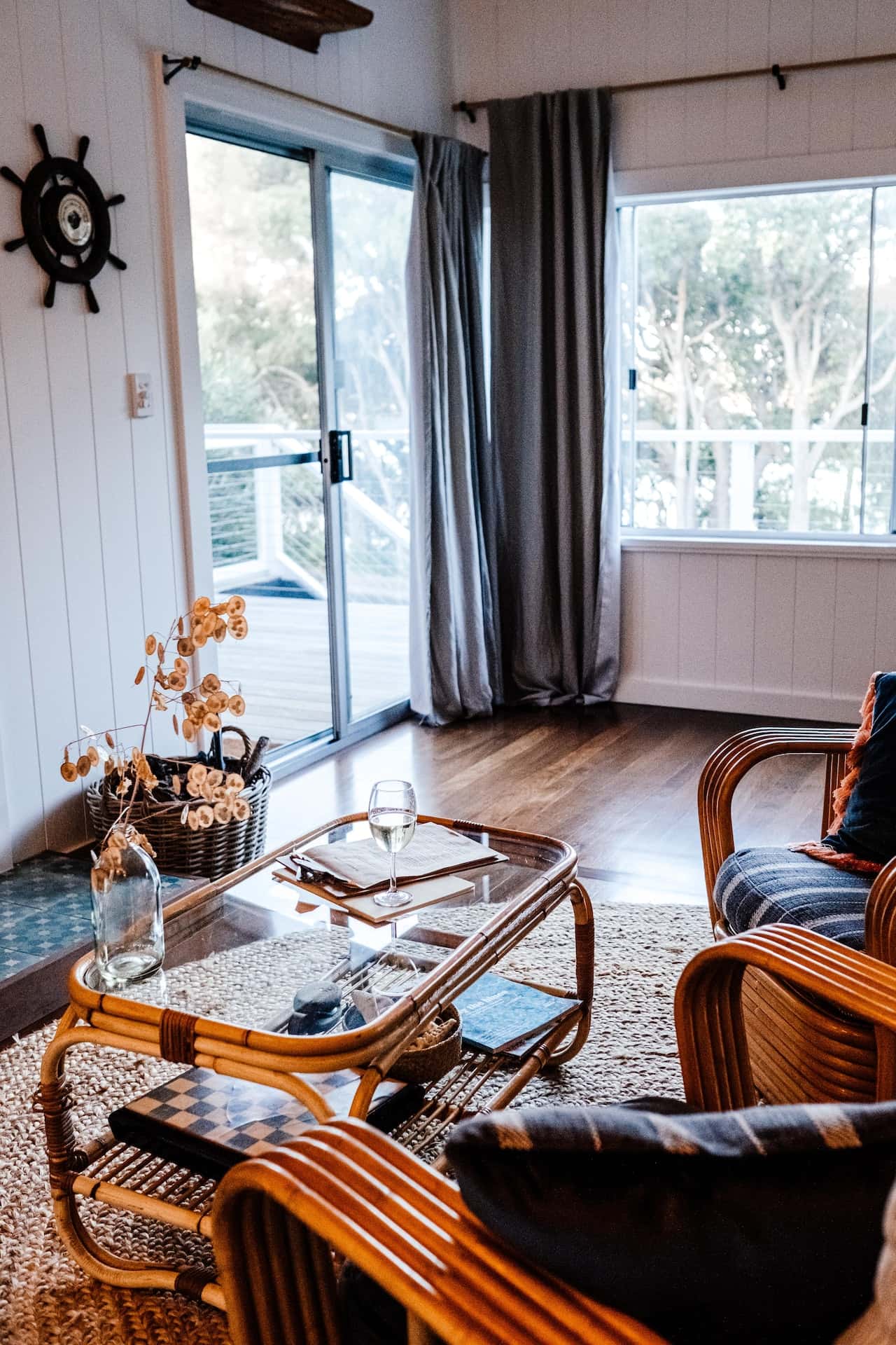 Stylish balcony mosquito net door in a cozy wood-floor home
