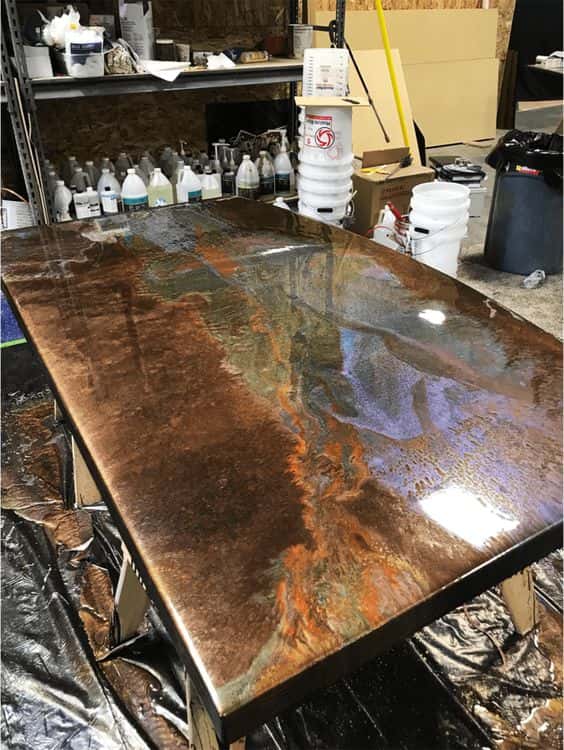 Best Kitchen Platform Designs abstract copper and black epoxy countertop.