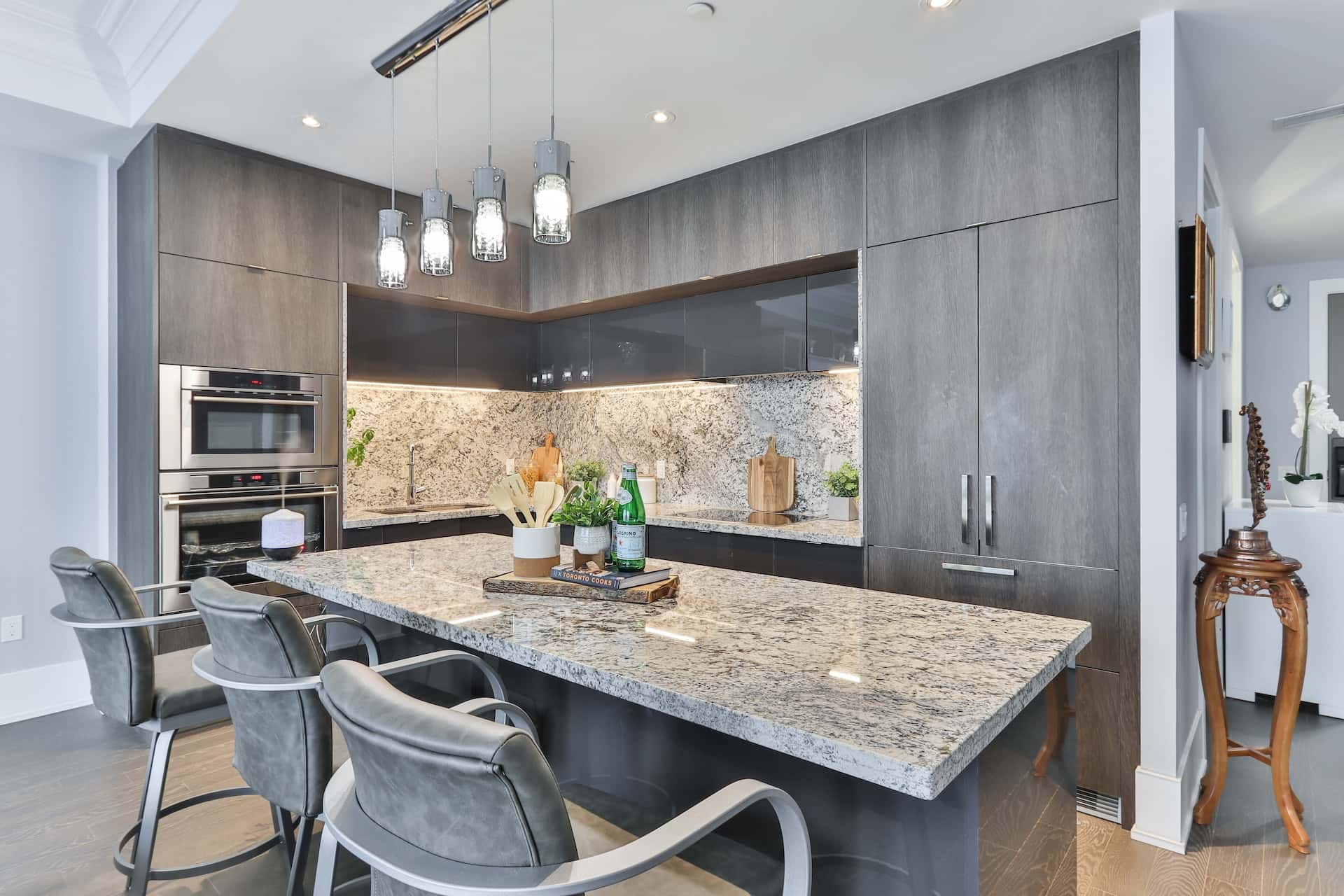Contemporary sleek kitchen modular designs with granite island and grey floor to ceiling cabinets