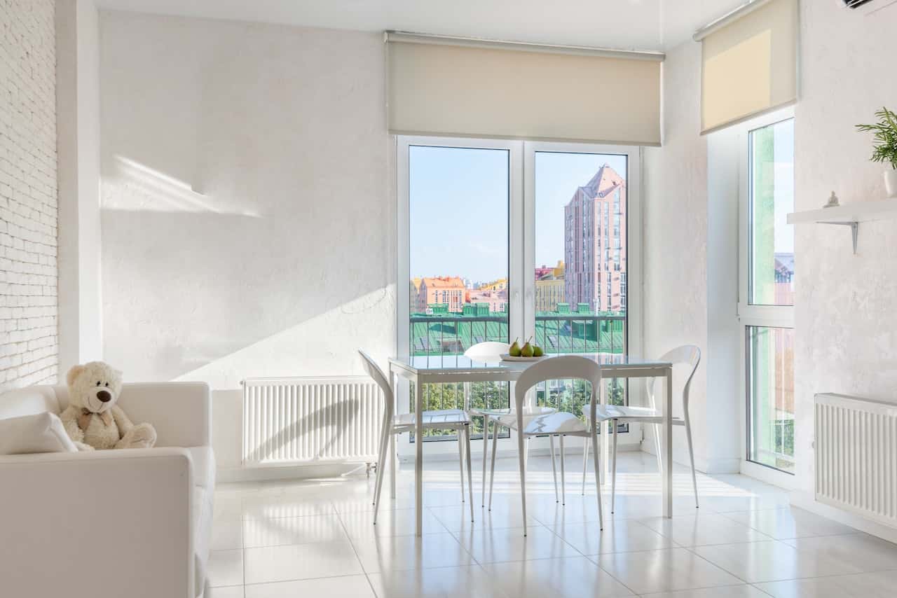 Bright balcony mosquito net door with modern city view