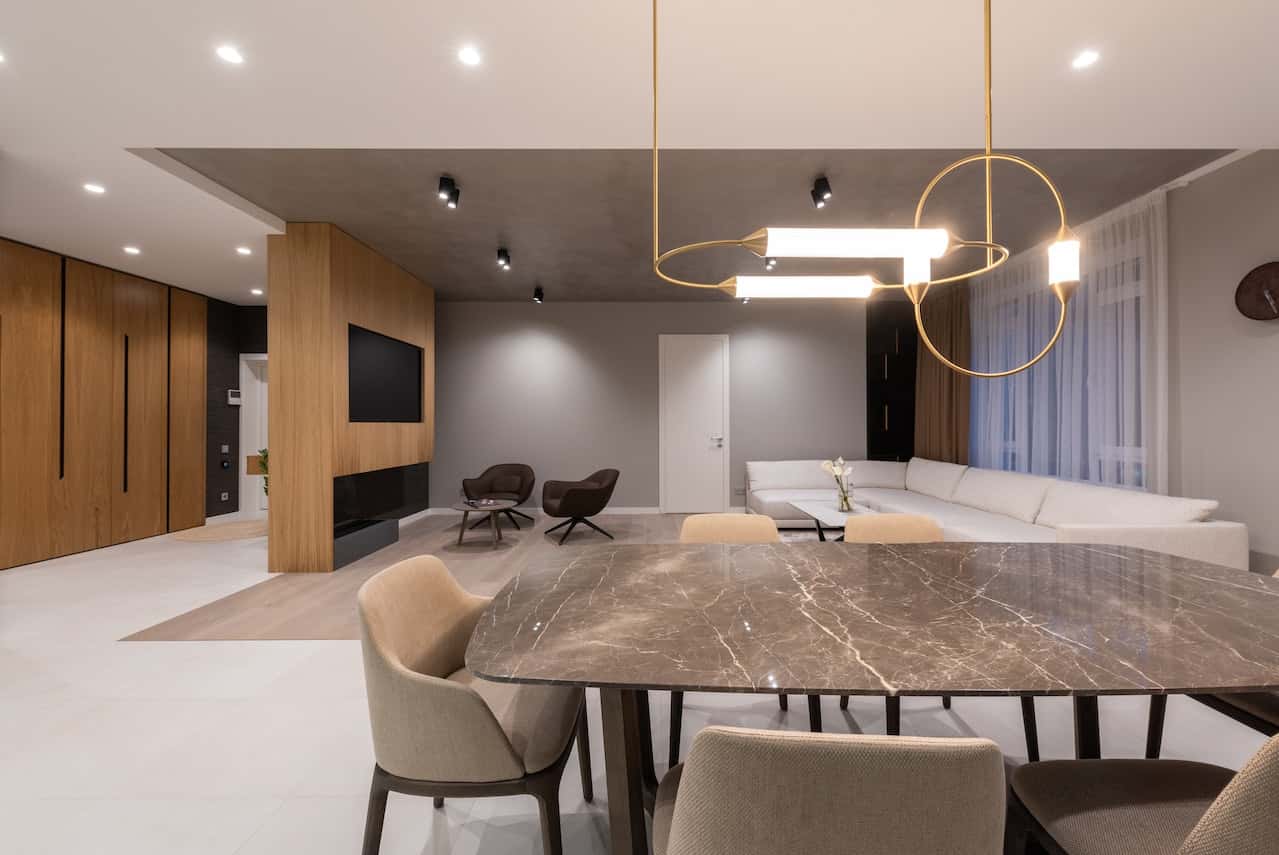 Modern living and dining area with sleek fiber ceiling designs and lighting