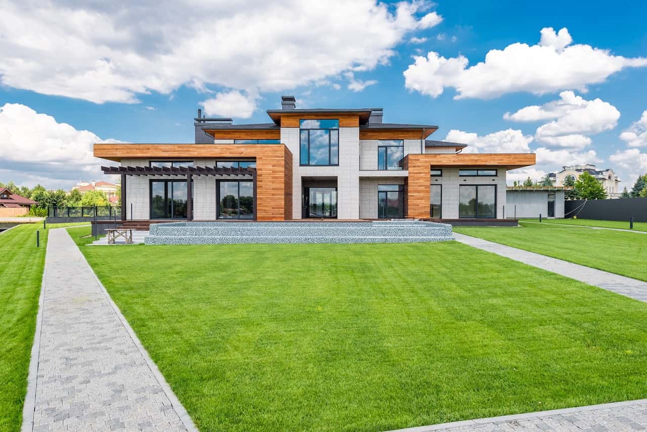 Grand elevation glass designs with wood and stone accents for modern luxury homes