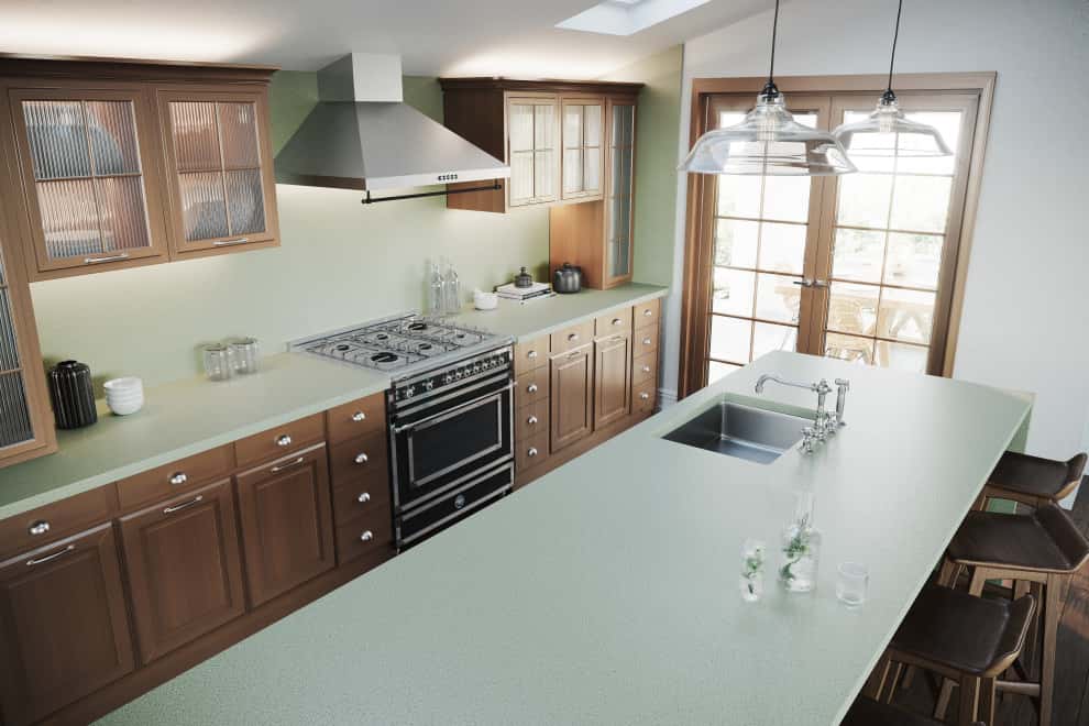 Elegant Kitchen Platform Designs light green countertop, wood cabinets, stainless steel appliances.