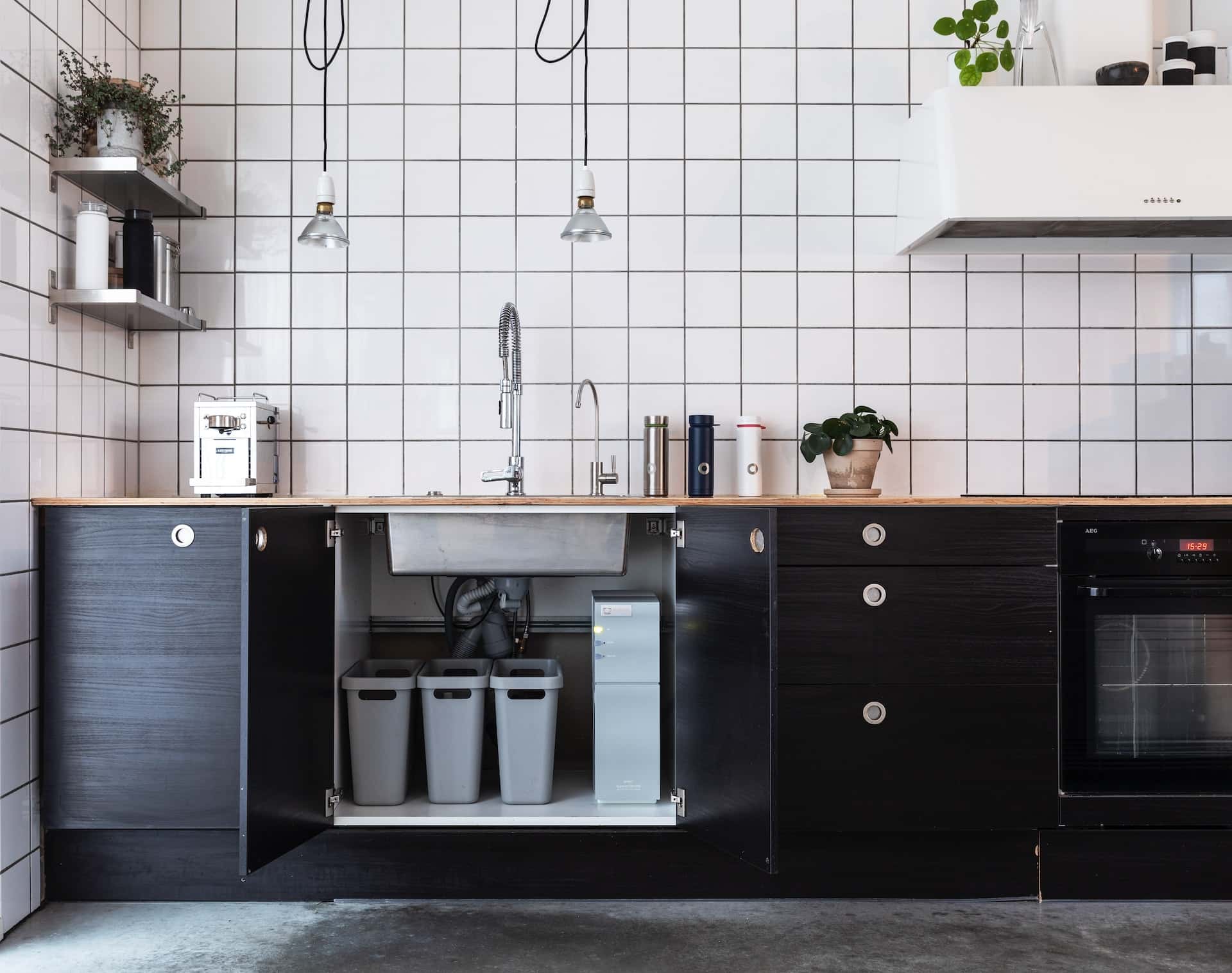 Minimal kitchen sink design with smart storage and faucet view