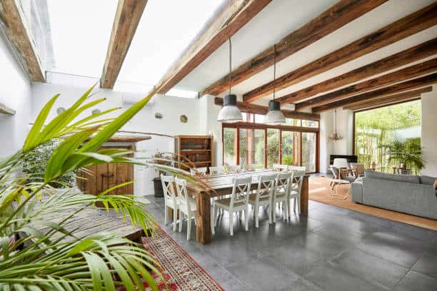 Glass ceiling design for home interiors with wooden beams and natural light