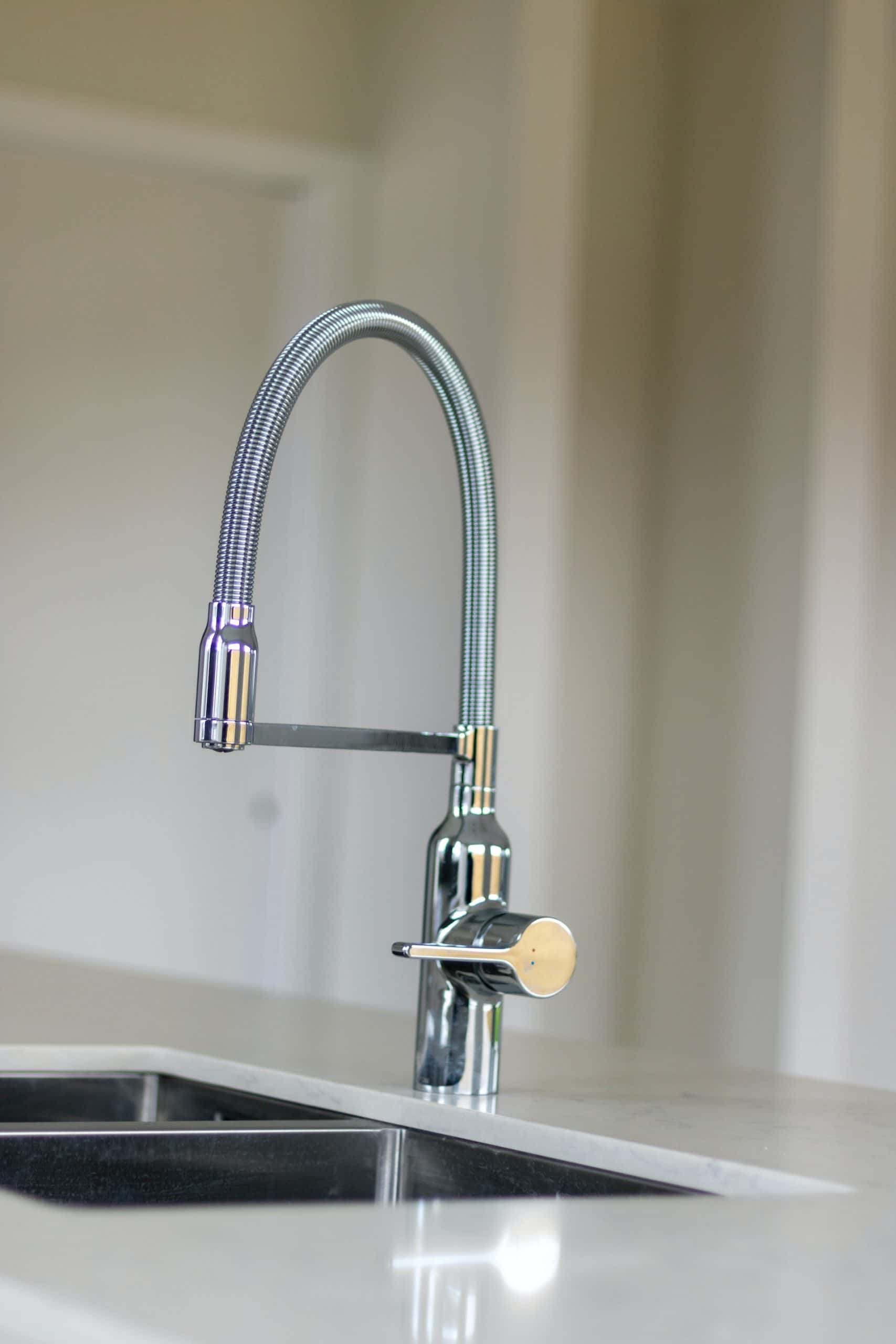 Modern kitchen sink design with tall flexible chrome faucet neck