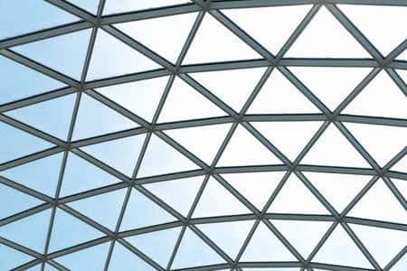 Modern glass ceiling design with geometric grid pattern for natural lighting