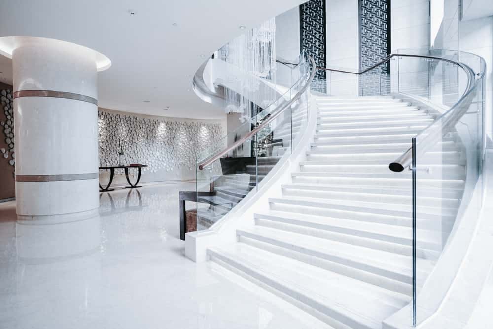 Modern glass railing designs for luxury interior staircase