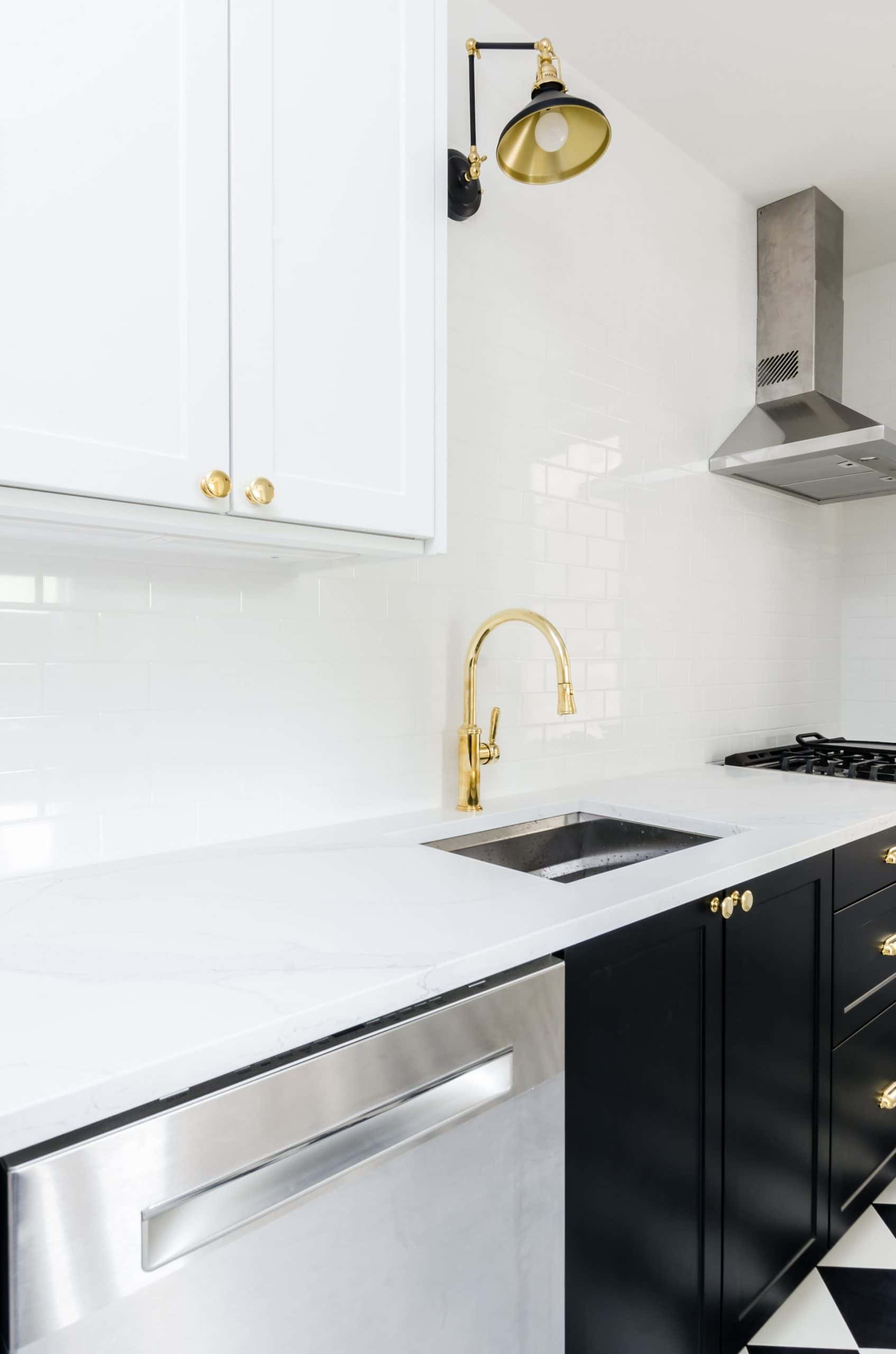 Contemporary kitchen sink design with marble top and gold finish features