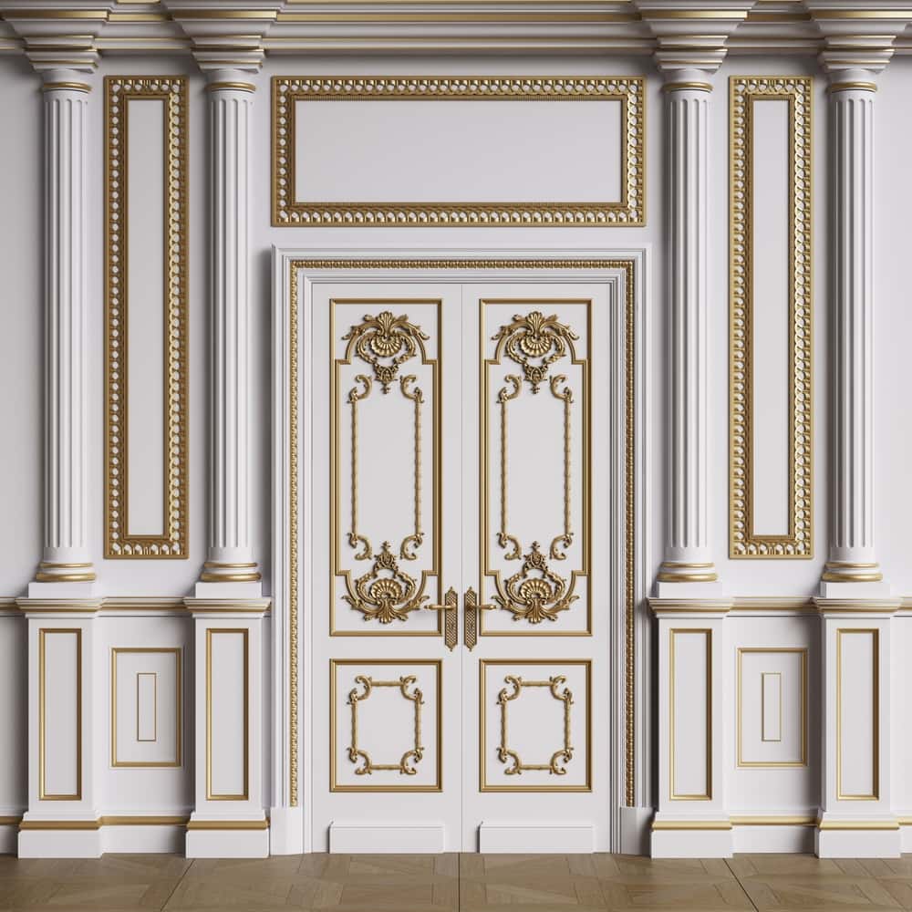 Luxurious gold-accented wall moulding designs with ornate double doors and classic columns
