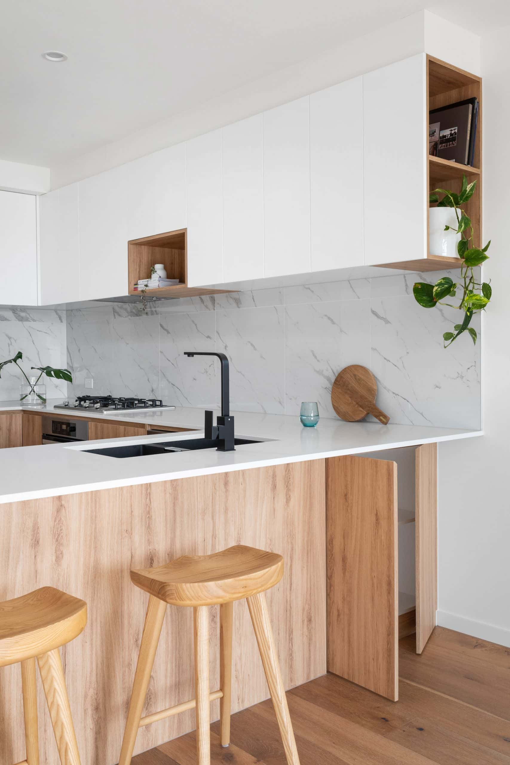 Minimalist kitchen sink design with white counter and island look