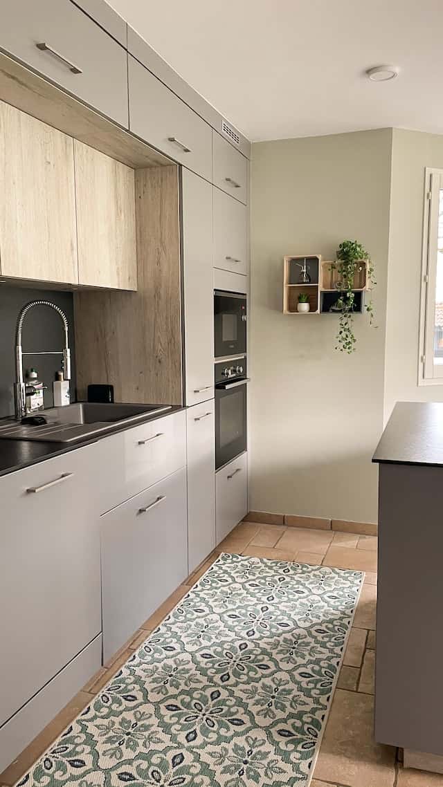 Modern smart kitchen design with grey cabinets and full-wall storage